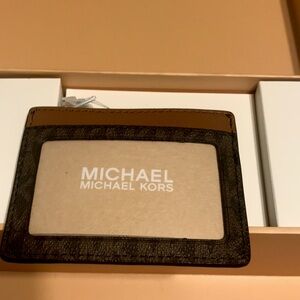 Michael Kors bland new  purse never used or out of original box brown and gold